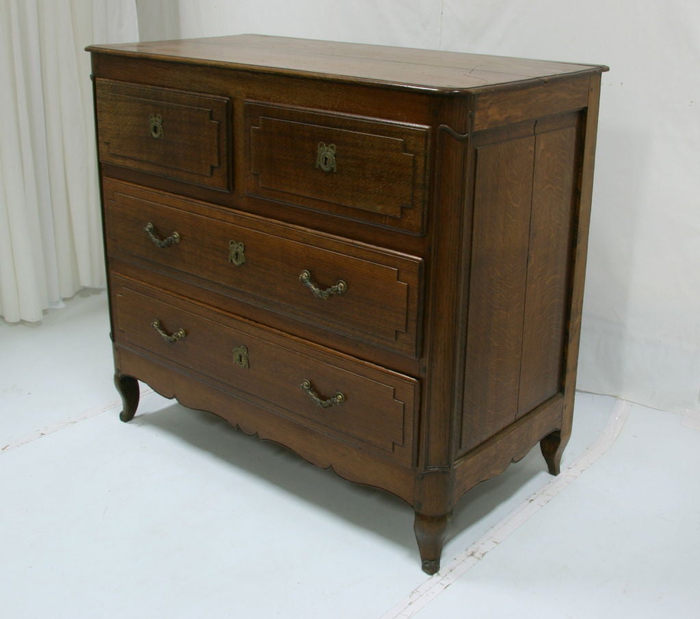 Early 19th  century French oak commode.
Measures: 41.5''H X 46'' W X 24'' D.