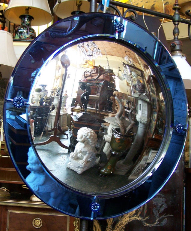 Wonderful blue glass frame with convex mirror.