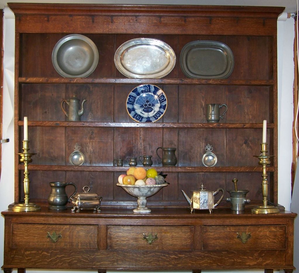 An oak dresser or plate cupboard with original finish.
