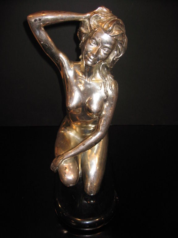 Silver plated nude act, sign but not readable.
 Black lacquered wood base.

 