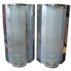 Pair of large glass rod and chrome sconces