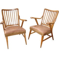 Pair of fruitwood and leather armchairs
