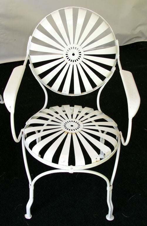 Extremely comfortable set of garden chairs fully restored and painted white. Two armchairs and two chairs.  More are available upon request but require restoration to be performed by us. Price is for one chair.