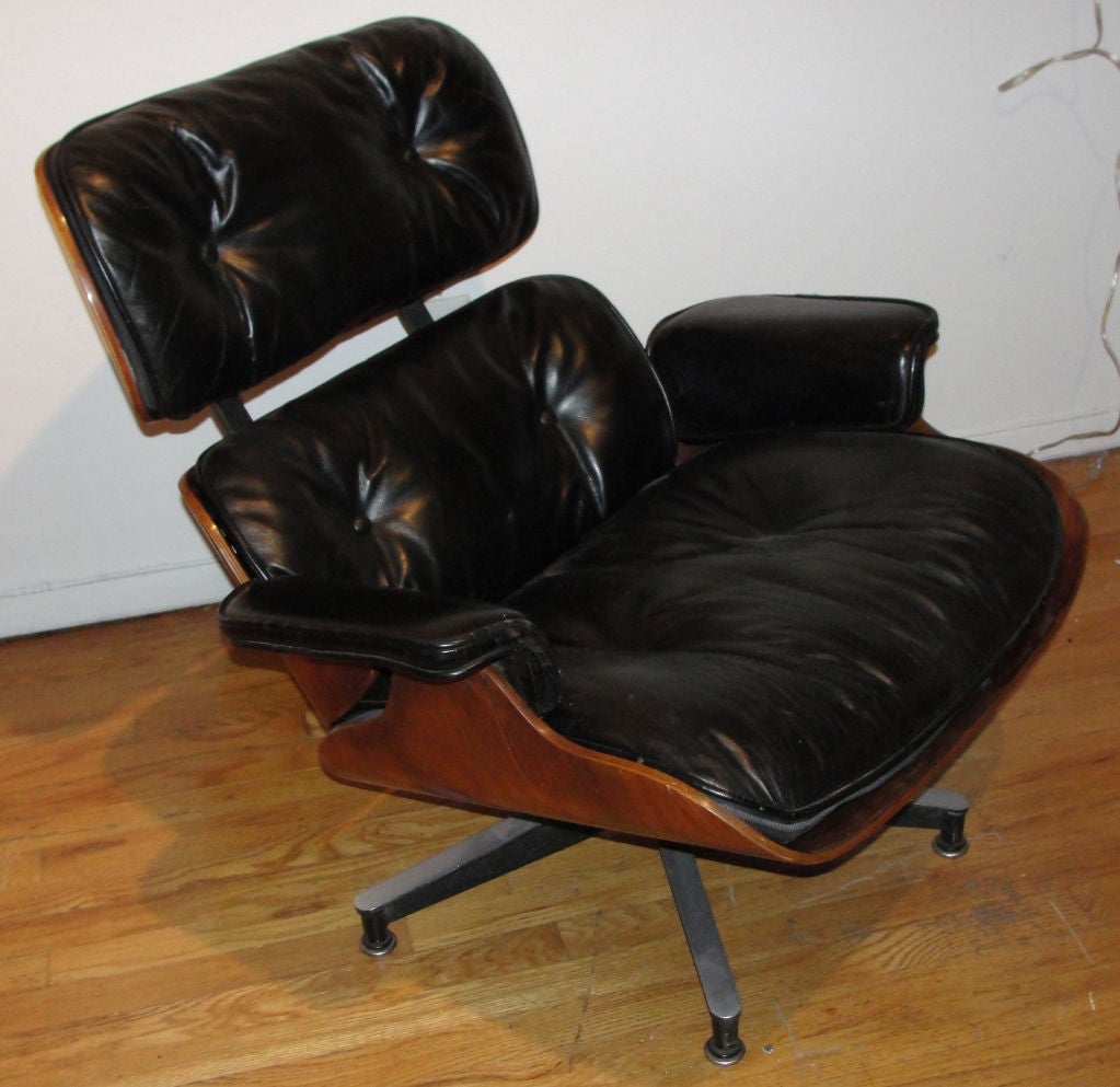 An original Eames lounge chair model 670from the firs 1956 series.  It has all the features of the first 1950's series: three screws under the arm that were used only in the first year production, dawn filling (later pumped up with additional
