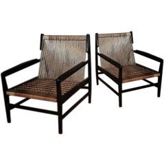A Pair of Low Laquered Armchairs with Nylon Woven Rope