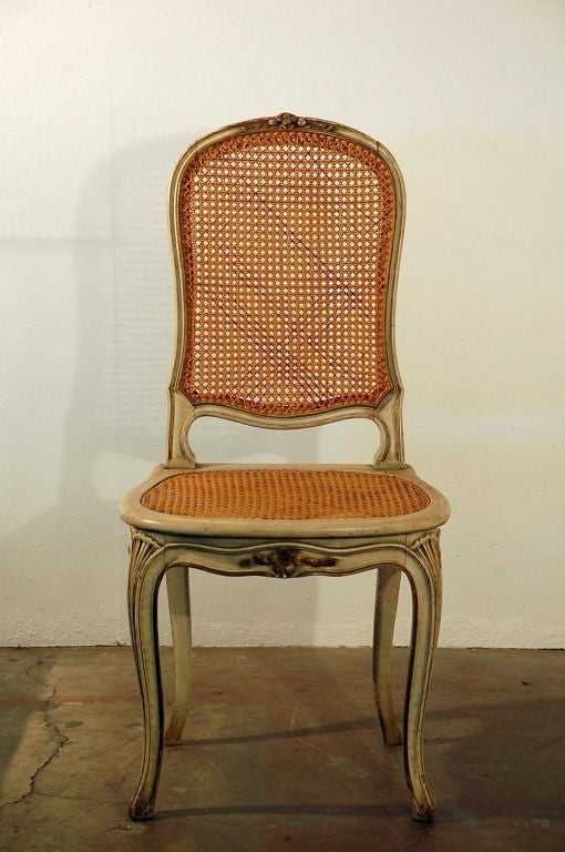 Set of 12 elegant caned French dining chairs