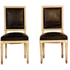 Pair of chic white washed Louis XVI black leather chairs