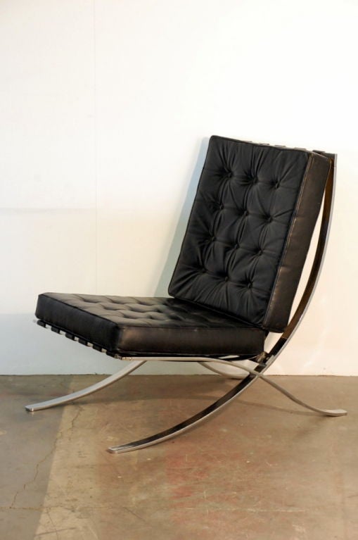 Large Mies van der Rohe style black leather lounge chair. Not the usual copy of the Barcelona chair. 18 in. seat height. 3 chairs are available. Priced Individually.