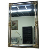 Curved Frame Mirror with Handcarved and Gold Leaf Decoration