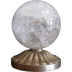 ROCK CRYSTAL SPHERE ON HAND CARVED WOOD BASE