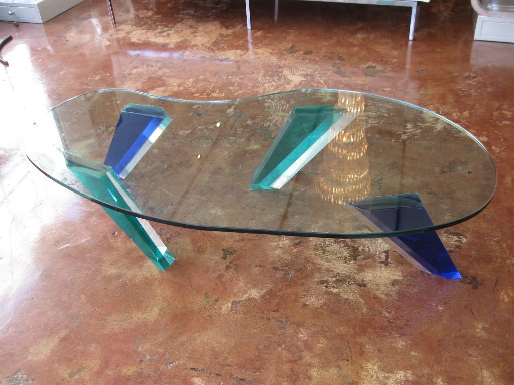 FREE FORM CLEAR GLASS COFFEE TABLE TOP WITH GREEN AND BLUE LUCITE LEGS