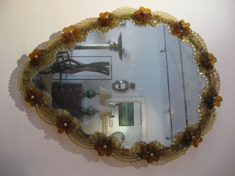VENETIAN FREE FORM MURANO MIRROR WITH GLASS FLOWERS AND SCROLLS.