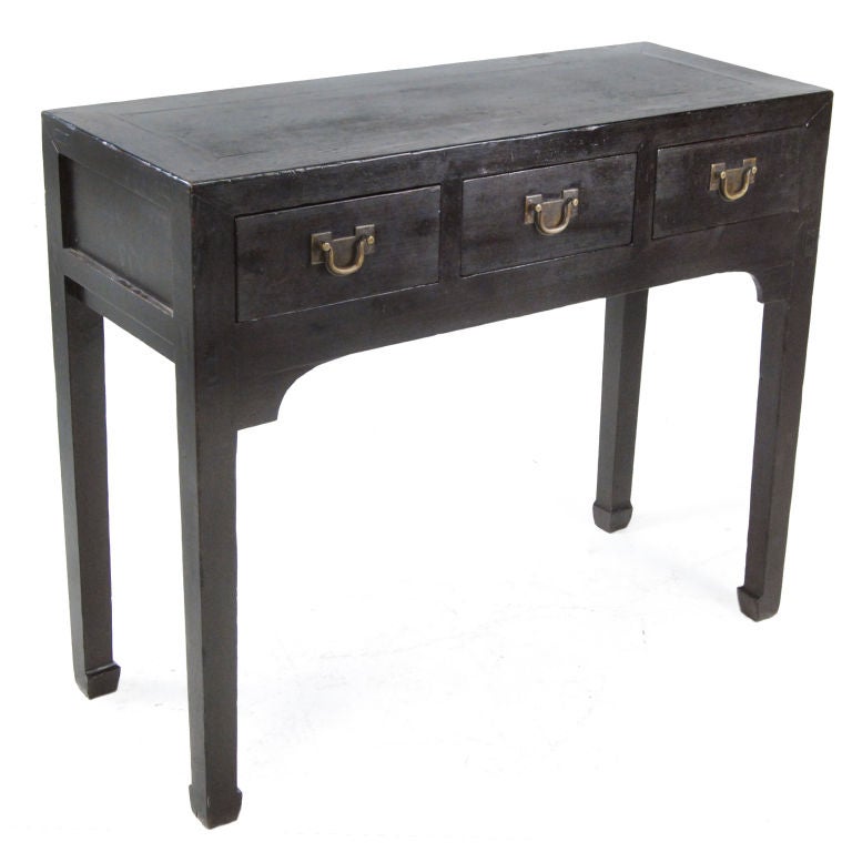 A 19th century Chinese elmwood altar table with three drawers, each with brass pulls with carved flowers.<br />
<br />
Pagoda Red Collection #:  DVB019<br />
<br />
<br />
Keywords:  Table, console, side, desk, entry, night stand, bedside