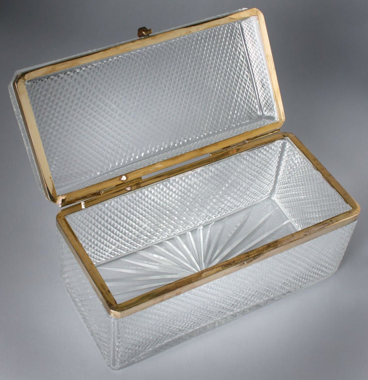 This is a wonderful large and optical dresser box with bronze gilt mounts. The design of the cut crystal is very clean and would compliment any decor. The box measures 9.3/4ths inches long x 4.3/4 inches deep and is 5.1/4inches high.
