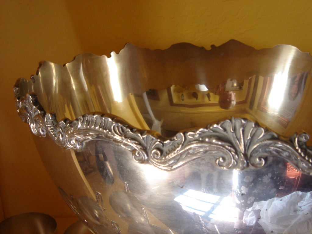 Punch <br />
Bowl Set with 12 cups and ladle all silver plate.  Very Well done wonderful trim to the top of bowl.  Can be uned as the cooler of wine or chanpaign