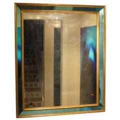 Elegant Italian blue mirror-framed looking glass