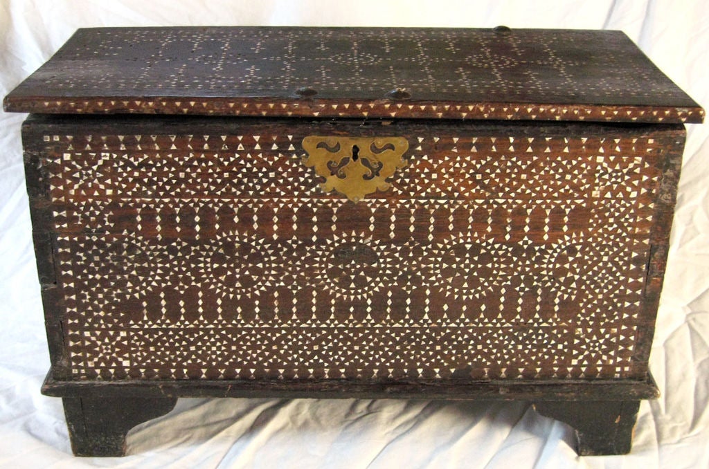 Beautiful near-pair of mother-of-pearl inlaid walnut chests with geometric decor, original hardware