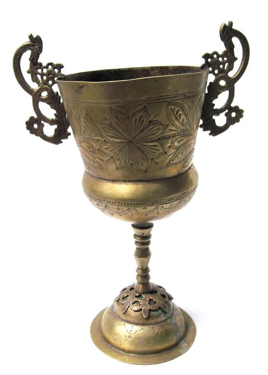 A fine pair of Peruvian silvered brass chalices or cache-pots