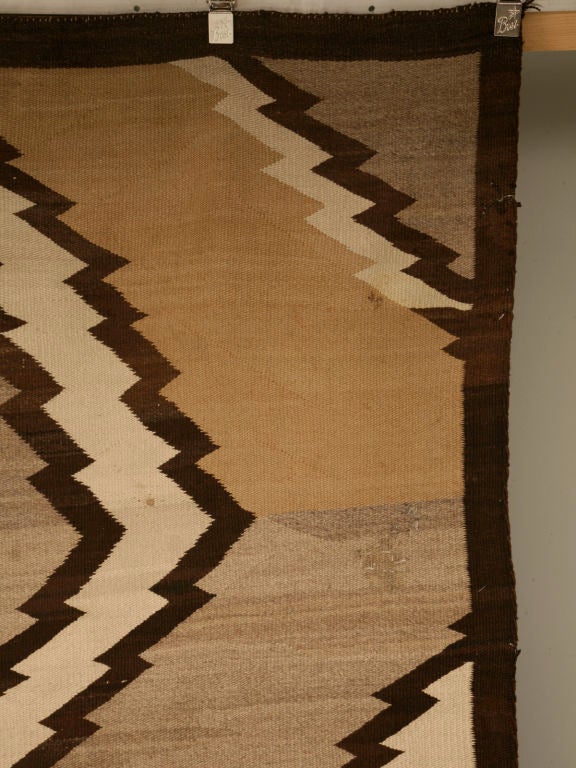Exquisite vintage hand-woven American Indian wool rug with an interesting diamond back design. Constructed without the use of dyes, this rug is an absolute showpiece. Unusually large, the natural neutral colors of this gorgeous rug would coordinate