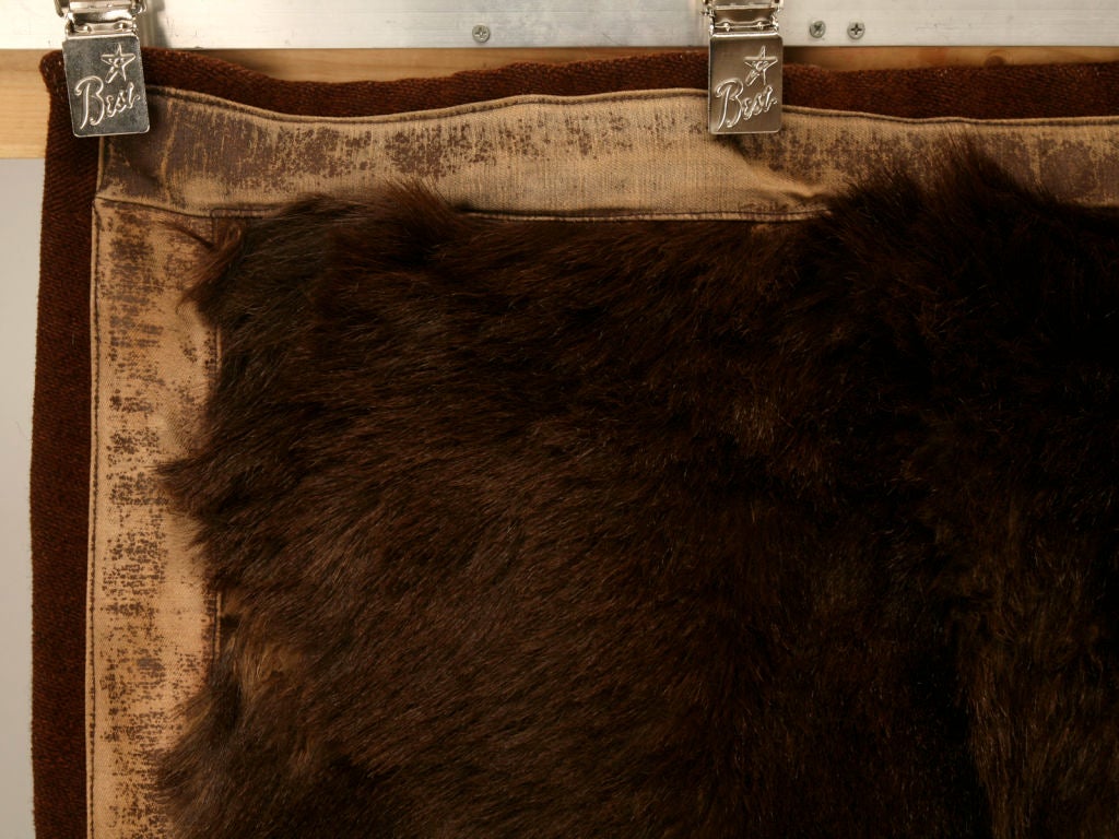 Perfect for snuggling on those chilly Winter nights, this beautiful bear skin blanket with it's wool backing will provide plenty of warmth. Appropriate used in a cabin, lodge, or at your own home, this awesome blanket would serve well on the floor,