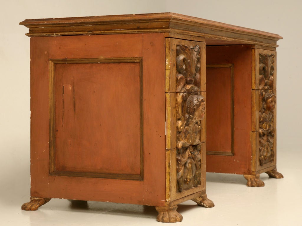 Jaw-dropping 19th century Italian carved and gilded 6 drawer desk or vanity, incorporating two 18th century Italian panels as drawer fronts. We were blown away when we spotted this awesome desk, immediately recognizing the fact that somebody over