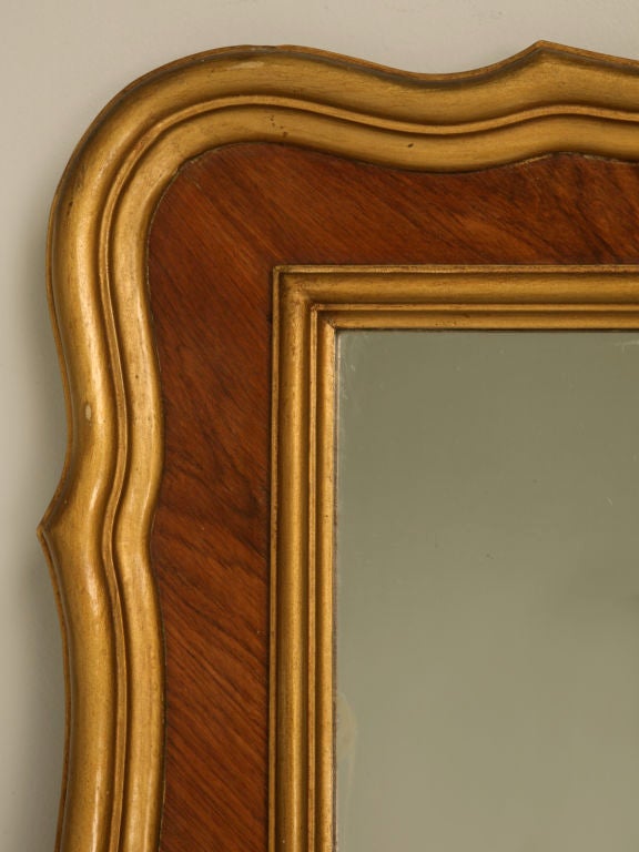 Sophisticated vintage French walnut framed 15 panel horizontal mirror. Place this striking mirror over a buffet and voila, you have just fooled your eyes into thinking the room has doubled it's actual size. In original condition this mirror is
