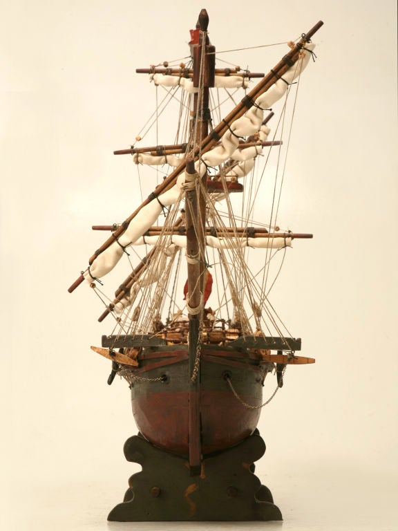 Highly detailed handmade vintage French wooden pirate's ship. This awesome model would add loads of character and charm wherever it might be used. Striking utilized on a bookshelf, in a library, or even in the bar, this wonderful vessel is not to be