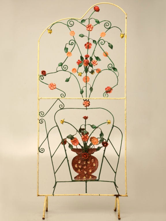 Unique resort furniture with floral motifs once dominated the Mediterranean coast, where it was very popular with visitors and locals alike. Made from steel with original paint, these screens were utilized as mobile dressing areas when dressed with