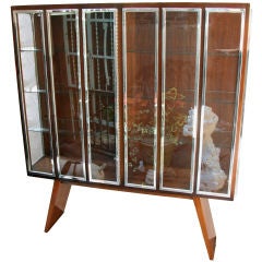 An American Walnut Vitrine with Raised Chrome Molded Edges