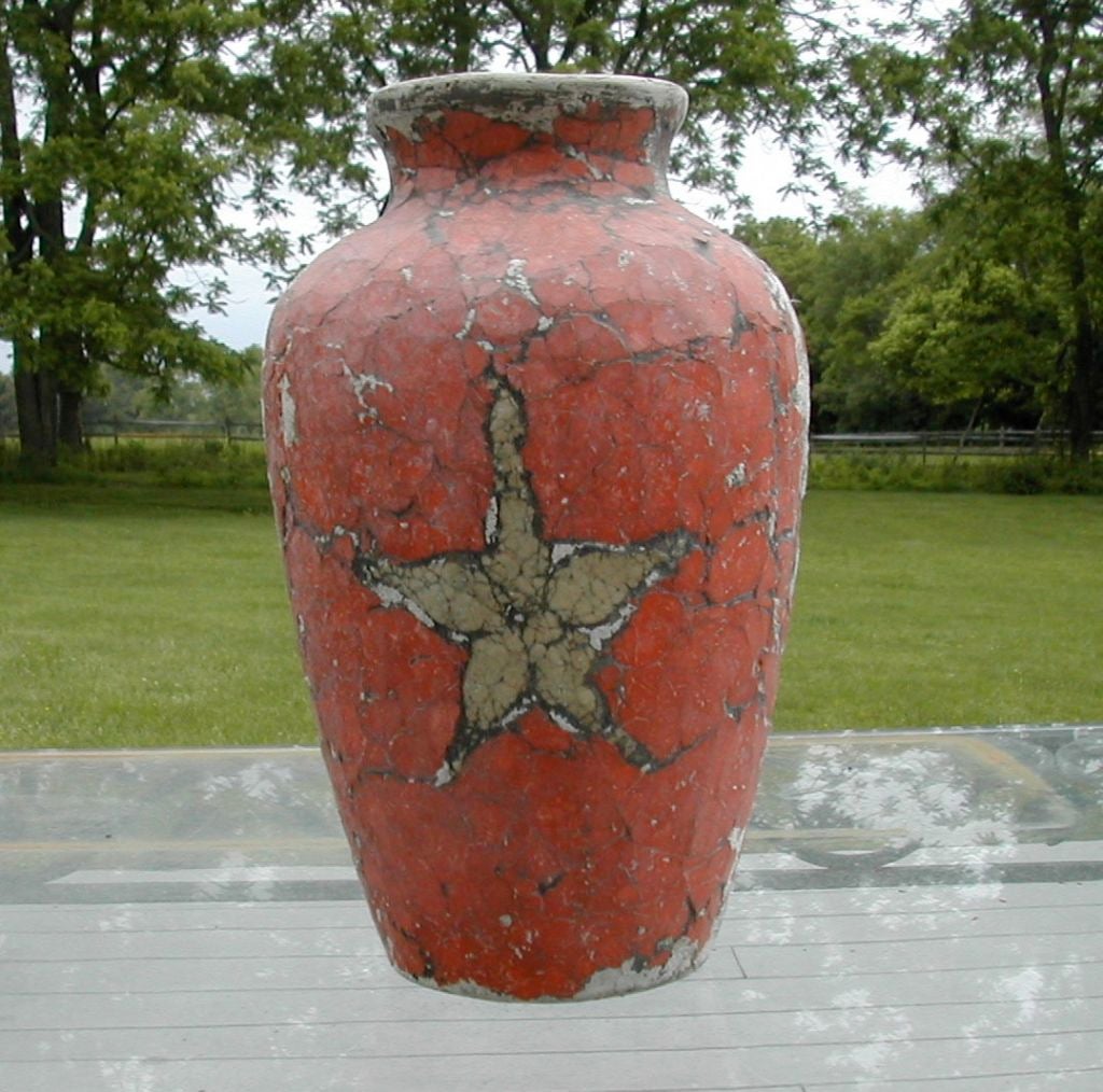 A graphically strong example of Bouck-White pottery with single star motif set in muted red field. This is one of a 150 piece Bouck-White collection