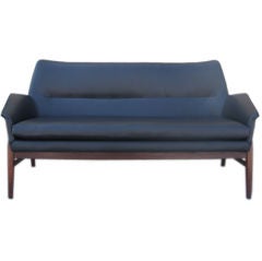 A Navy Blue Leather Danish Modern Sofa on Carved Teak Frame