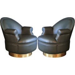 A Pair of Rolling Leather Armchairs with  Large Brass Handles