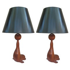 Pair of Carved Teak Seal form table lamps