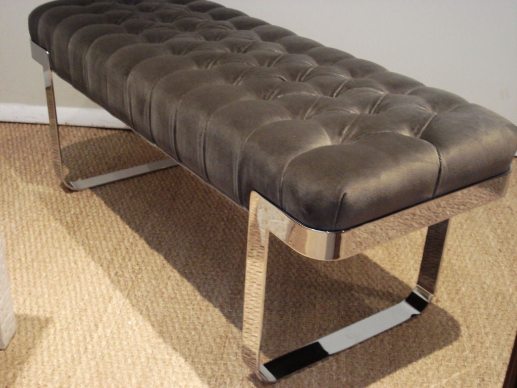 Elegant chrome base bench, newly upholstered on a tuffted taupe thick velvet.