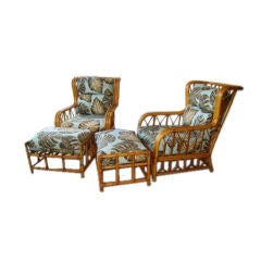 PAIR OF RATTAN WING BACK LOUNGE CHAIRS AND OTTOMANS