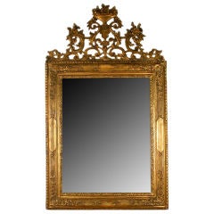 A Boldy Carved Italian LXIV Giltwood Mirror, early 18th cen.