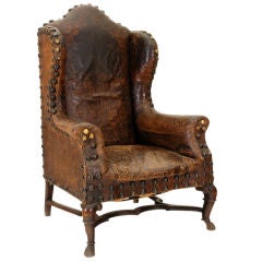 Antique An Italian Walnut and Leather Upholstered Large Poltrona