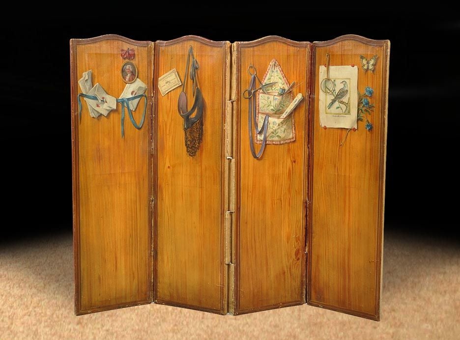 # T088 - Decorative painted trompe l'oeil four panel folding screen painted in a faux light wood finish with a darker surrounding border, each panel measuring 24