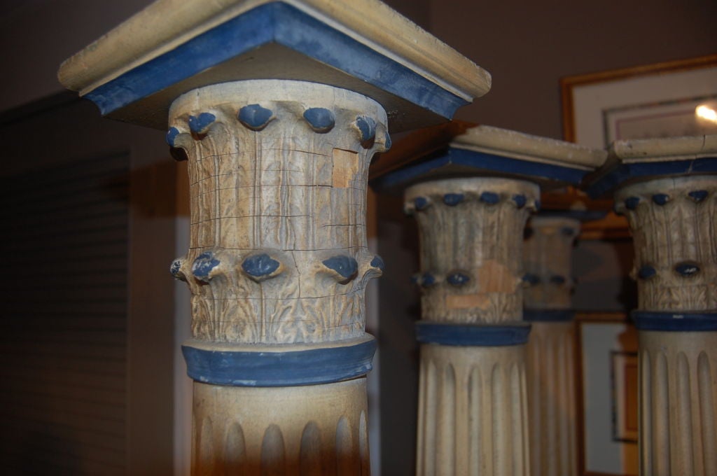Set of four carved and painted wood columns aged white and blue paint
