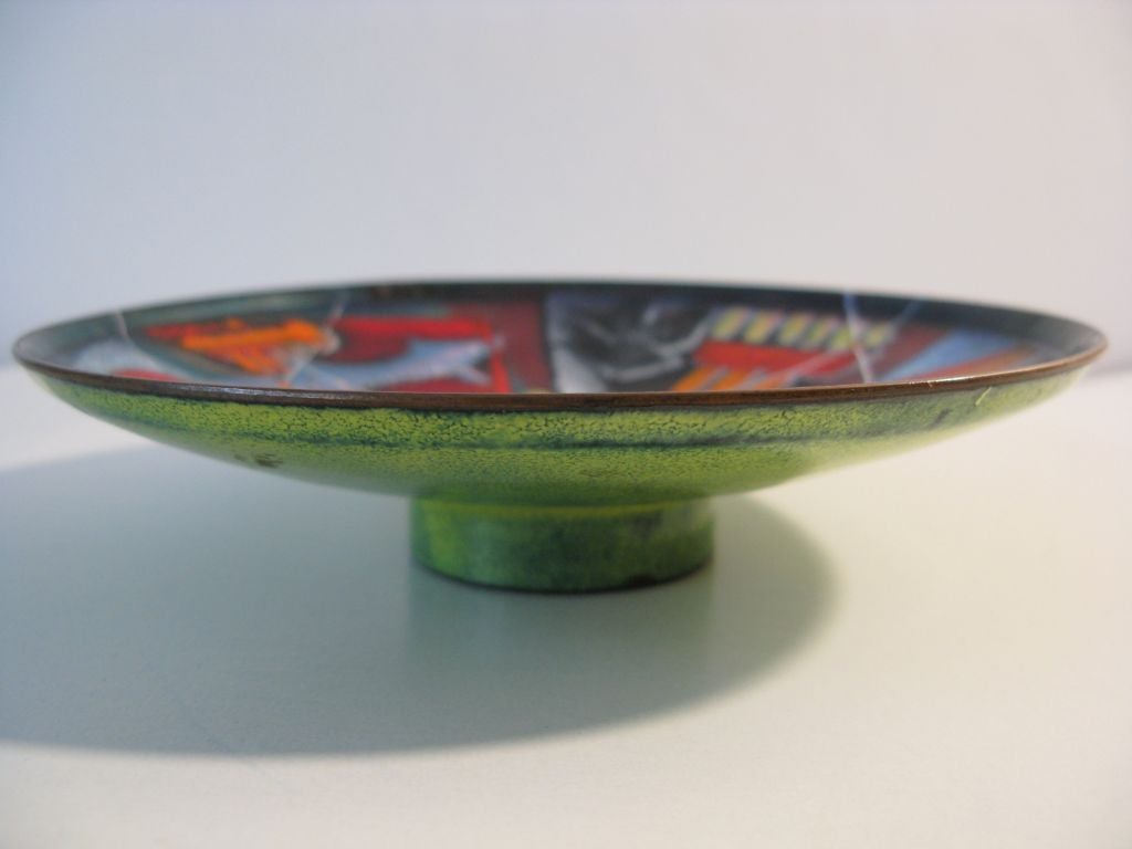 Colorful and iconographic enamel on copper footed bowl by Pittsburgh artist Virgil Cantini (1919-2009).  Cantini was a graduate of Carnegie Mellon who was shown in the Syracuse Ceramics Nationals in the late 1940's, and taught Fine Arts at U of