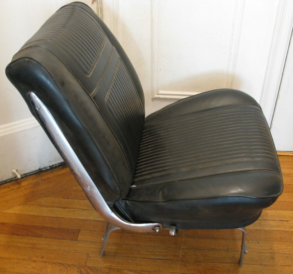 Unique chair created out of folding car seat and flat band steel.  Visually interesting and comfortable. Home construction, c. 1960's.