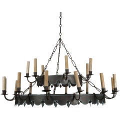 An antique double-tiered tole chandelier