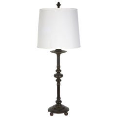 An antique cast bronze table lamp by maker E. F. Caldwell