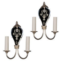 Antique A pair of two arm silverplate mirrorback sconces