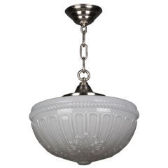 An antique cased glass pendant with foliate details