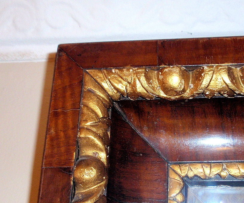 A circa 1900's Swedish beveled wooden frame mirror with gilt detail.

Measurements:
Height: 39