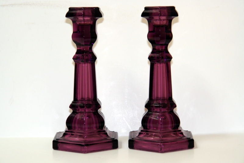 Pair of circa 1940s French molded amethyst glass candlesticks.

Measurements:
Height 7.5