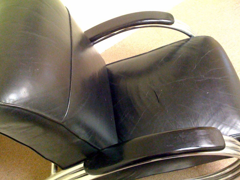 K.E.M. Weber (1889 – 1963) designed this streamline American art deco triple band armchair for the Lloyd Manufacturing Company.  The chair features machine age triple band chrome arms enclosing a sprung leather seat and back.  The chrome and leather