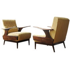 Sexy sleek pair of solid mahogany Brazilian lounge chairs.