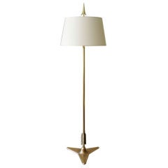 Italian Art Deco bronze and brass floor lamp with tripod base.